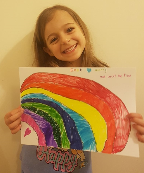 Junior School pupil with rainbow